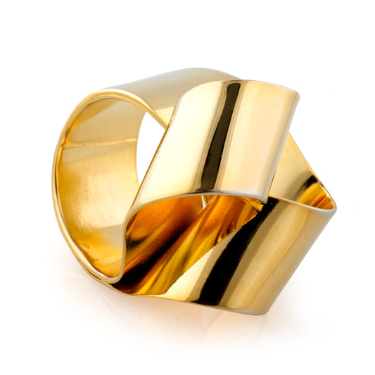 Bloom Ring from The Brass Band Collection-The Golden years is a simple folded sculptural piece but a statement on your hand.  Looped shapes have floral like appeal, hence the name Bloom.   ~approximately 5/8" wide and fits wonderfully on the finger with a bit of drama! This will definitely be a conversation piece and a great Oblik Atelier collection piece.   Ring is made out of brass and finished with 14k nickel free  gold plating   Handmade in Brooklyn, New York