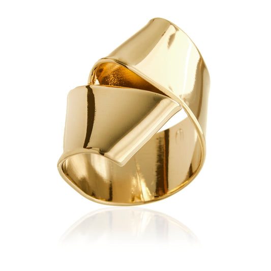 Bowtie is a hand formed ribbon resembling pasta that wraps around your finger.  It is fabricated in brass and finished in 14k gold plating