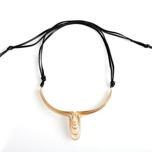 You are just like the Queen.. Hatshepsut is a beautiful frontal necklace.  It sits around what I find to be the most sensual part of a woman's body- collar bones, and it points into the other sensual parts:)  ~ 4.5-5" wide and about 4" deep  This necklace is beautiful to wear directly on the skin, or in colder weather wear it over your turtle neck or crew neck..  Necklace is hand formed in brass and finished with 14k nickel free gold plate.  Leather in the back with a signature Oblik Atelier closure.