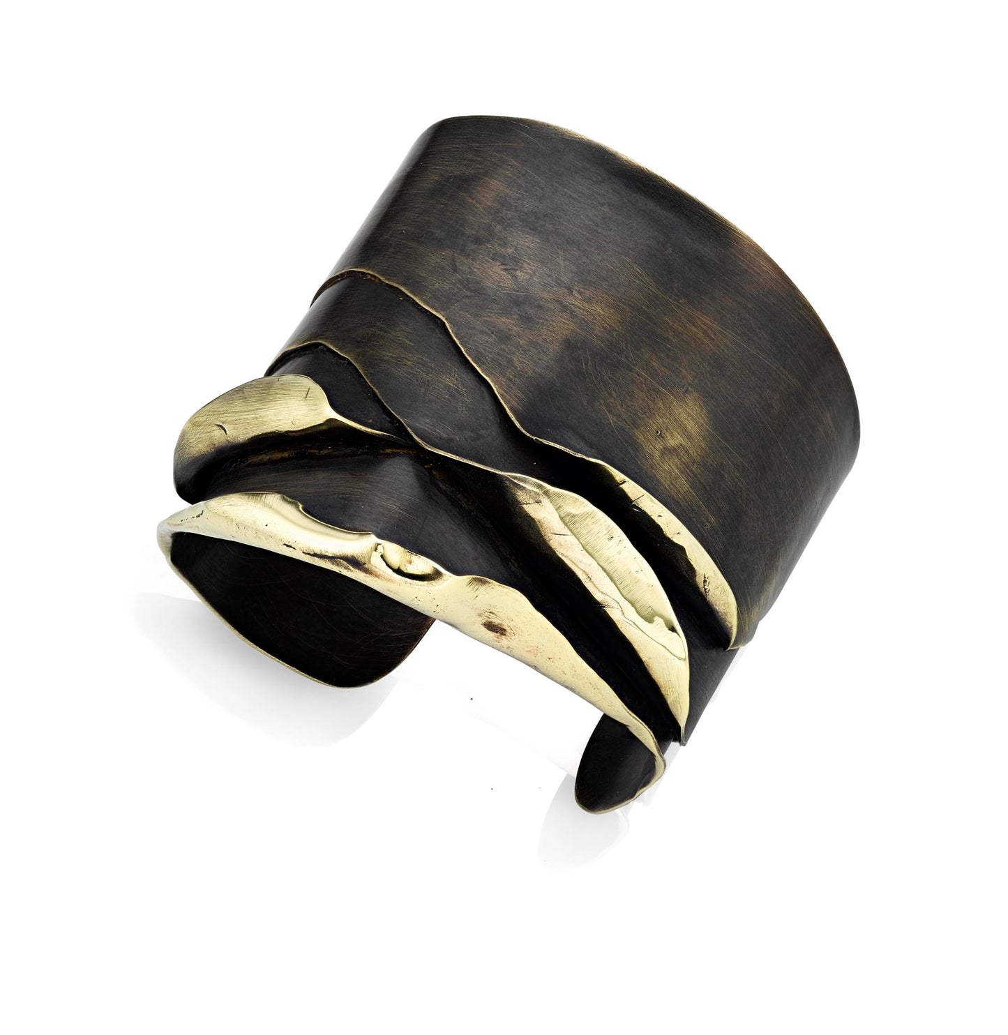 This is a piece of art cuff bracelet. Hand fabricated out of 4 separate brass sheets. Each is hammered and bent as though it's being peeled from a core. A sculptural piece of jewelry and very unique.  ~ about 2" wide   ~ brass with patina finish