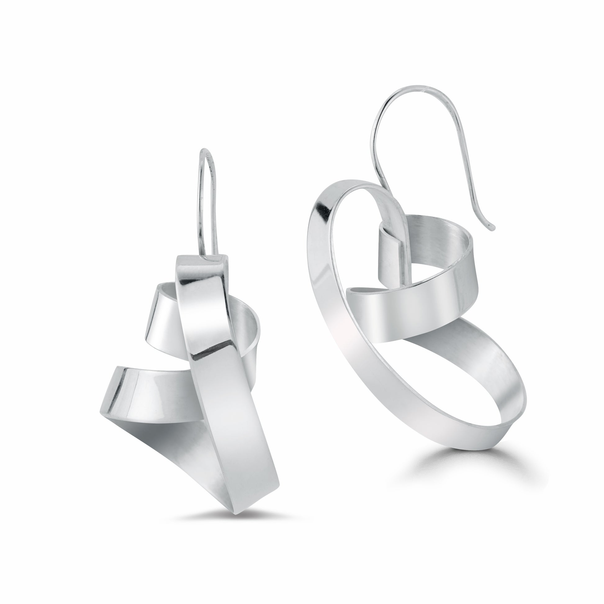 This is a beautiful and sensual earring in the Elemental collection. Made out of a continuous and wrapped strip of 5-6mm sterling silver sheet. Ear wire is integrated so it sits in the most perfect way from the ear.  The shape hugs the face  in such a complimentary way and you can choose which way the earring is worn.   Around 1.25-1.5" long depending on the coil, and about .5" wide  It is lightweight because it is hand fabricated out of sheet of sterling silver.