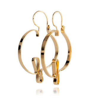 Hand formed hoop earring with a middle being a representation of a heart beat. It is 2" and 1.25" wide, made in brass with 14k nickel free gold plating. Also available in sterling silver