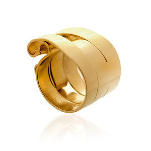 This is a classic ring. Inspired by the best selling cuff. Buckle up. Each is slightly different made up of 5mm strips of metal joined together. with a slight fold over. Easy to wear this is your staple, wide and gorgeous but less flamboyant! It is 15mm (1/2") wide approximately . Ring hand fabricated in brass and finished with 14k nickel free plating. 