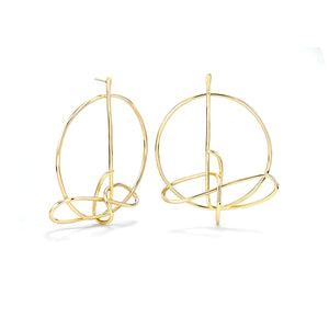 Drawing No4 earring is a frontal post earring that frames the face.   ~ 2" in diameter,  Nice dramatic, statement earring, but easy and light to wear.  Earring is hand fabricated out of 1mm brass single wire that is coiled onto itself. Finished in 14k nickel free gold plate.  