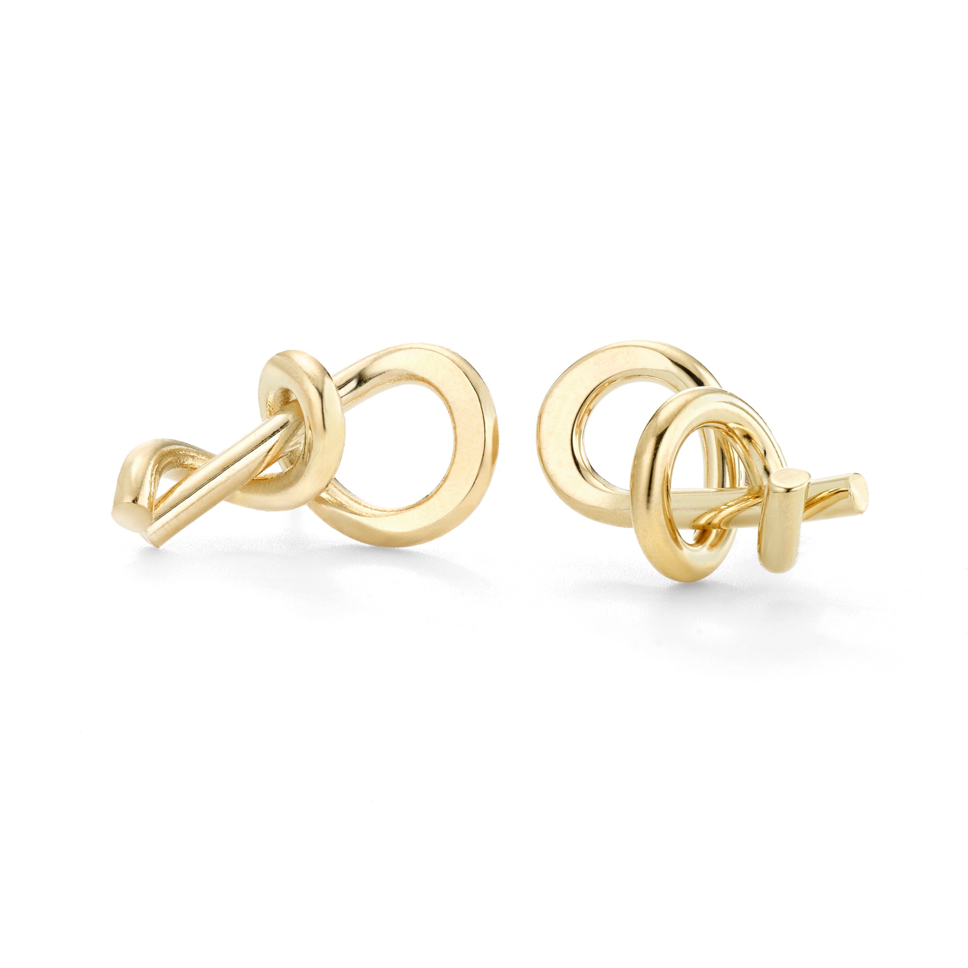 Small scale studs. They are a matched pair of earrings.   ~ 1/2-3/4" size  Each is unique as I am bending wire in a very tight curve and metal is unforgiving.  Hand formed in brass with 14k nickel free gold plating.  Also available in sterling silver
