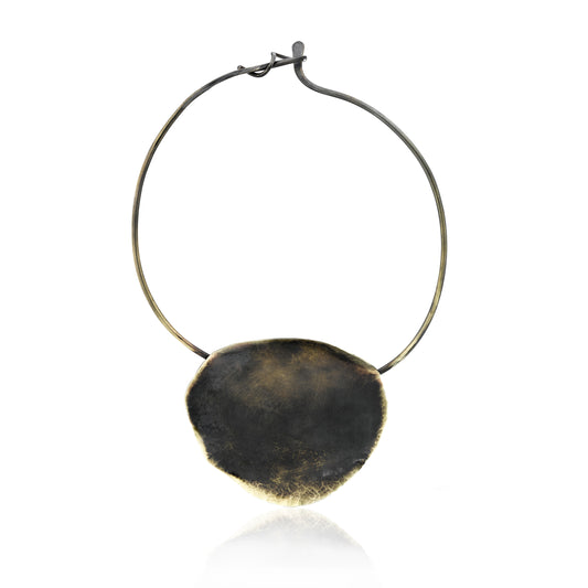 frontal collar necklace with a full moon shaped disc. Hammered details finished with patina over brass. Pendant is 3.5"-4" in diameterWhen I finished this unique collar necklace, I thought of a moon and an eclipse, hence the name  Each necklace is hand cut brass, hammered on the edges soldered to a hard collar. Finally it is finished with a patina.   Collar is about 5.5" in diameter, the moon pendant itself is 3.5-4" i diameter  Each piece is unique and please allow the variance.
