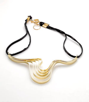 This unique frontal necklace is made out of 5mm thin sheets of brass formed into a Ripple effect. This is an everyday necklace that sits on the most sensual part of the body- collar bones.   It is about 5" wide and 3.5-4" tall - allow for slight variance as each piece is hand formed.