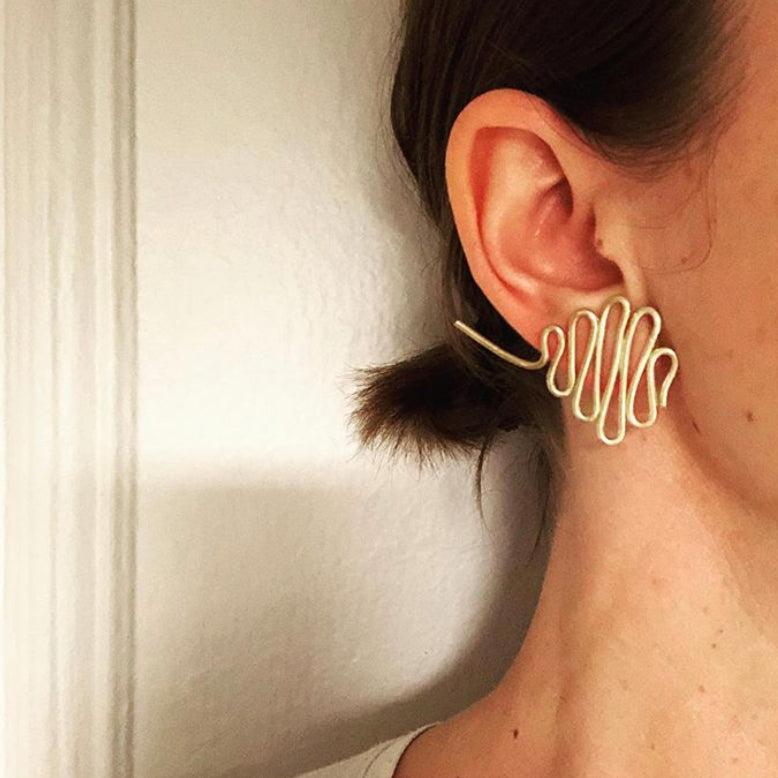 Goldsworthy oversized button earrings