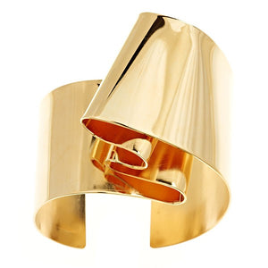 Gold plated brass cuff bracelet from the Brass Band Collection-The Golden Years  This is Oblik classic timeless cuff and a best seller. The folds evoke Richard Serra the sculptor.  It's an empowering design you'll keep coming back to in your jewelry box.  ~ 1.5"wide  that is 1.5" wide and about .5" high on your wrist.  Hand formed in brass and finished in 14k gold, nickel free plating.