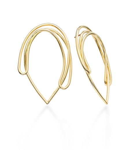 Drawing No1 started the Drawing Series collection. Mia thinks of it as a wire drawing for your ear. We created an interesting and an unusual silhouette that is bold in shape but light to wear. It sits on your ear and covers the hole on the top, making it an unusual post earring that looks like a modern frontal hoop.   ~ hand fabricated in brass wire with 14k gold plated finish ~ post back is made out of 14k gold-filled material   ~ approximately 2" long, and about an 1" wide  