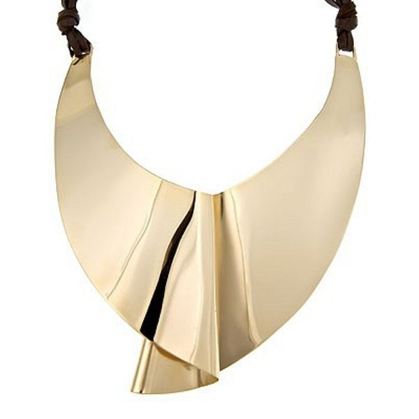 Moby Dick statement necklace is our signature piece from the Brass Band Collection  This is a bold piece and a piece that was part of the original line up of the Brass Band. Necklace is shield like, incredibly light measures 6"x 5" and it ties in the back so it's easy to find appropriate length for your chest.  Finished with soft leather straps, a nice contrast to the oversized shield. 